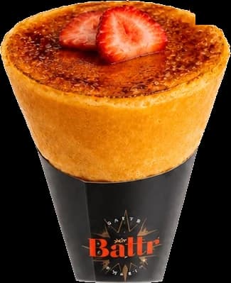 The Creme Brulee crepe cone — a torched sugar crust topped with two strawberry halves, in a black Battr cone.