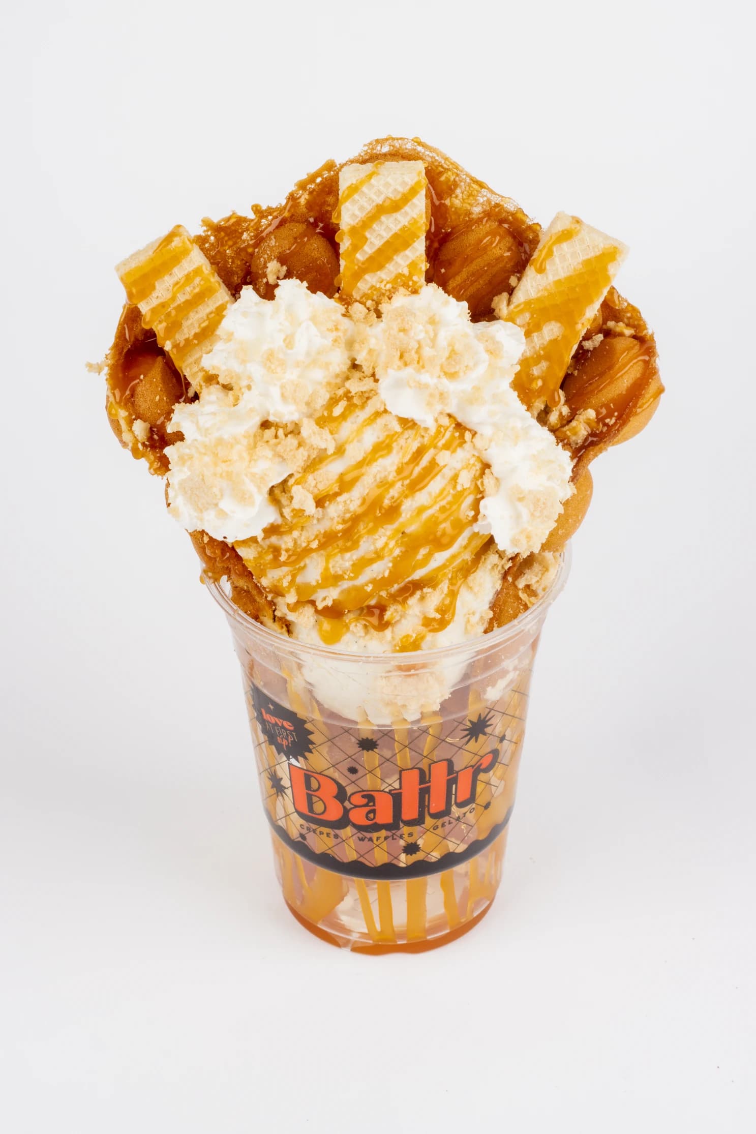 Three Broomsticks Butterbeer bubble waffle with vanilla gelato, whipped cream, vanilla wafers and butterbeer syrup.