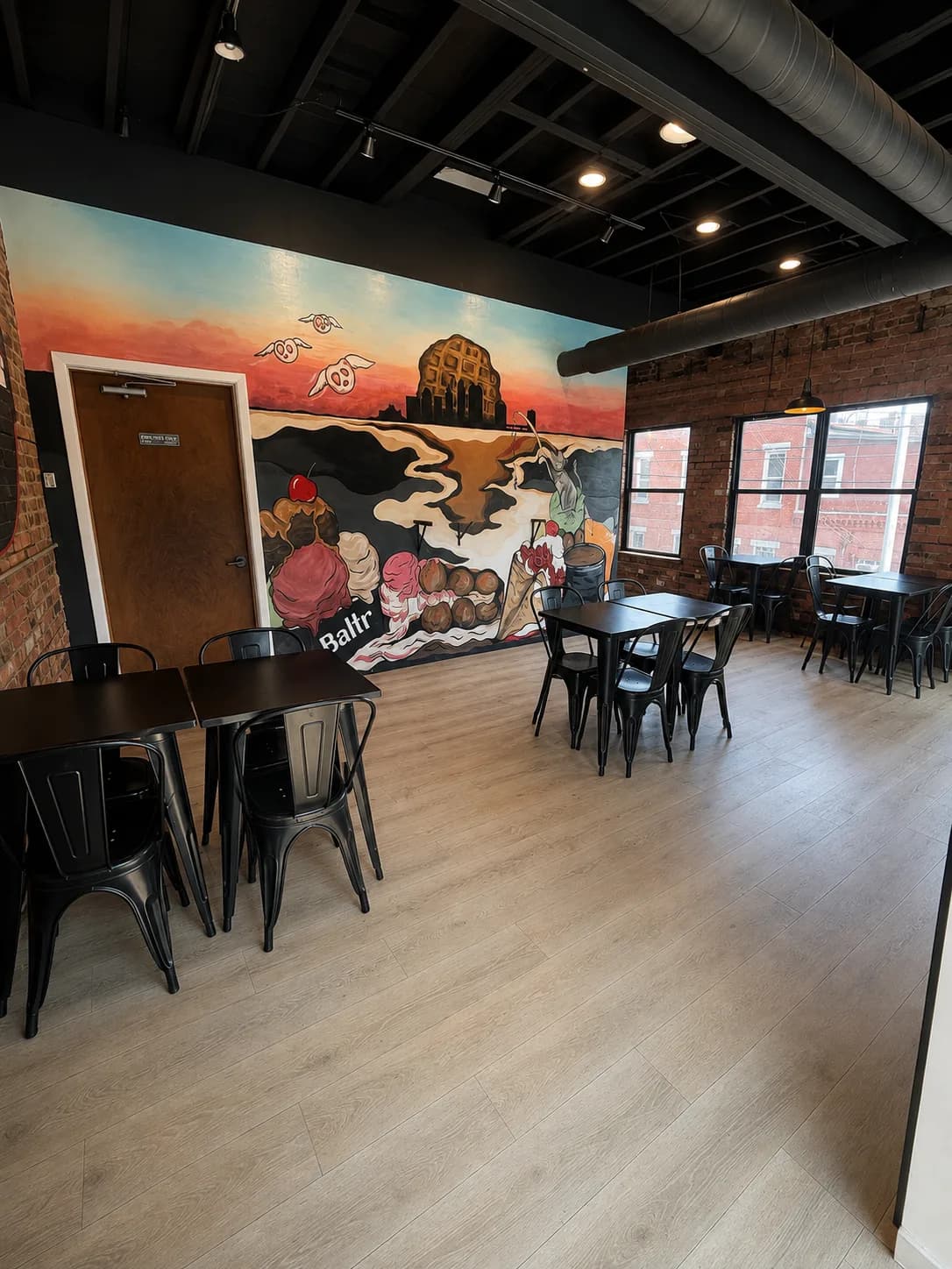 The mural at Battr Tremont: a Cleveland skyline painted from bubble waffles and gelato scoops.